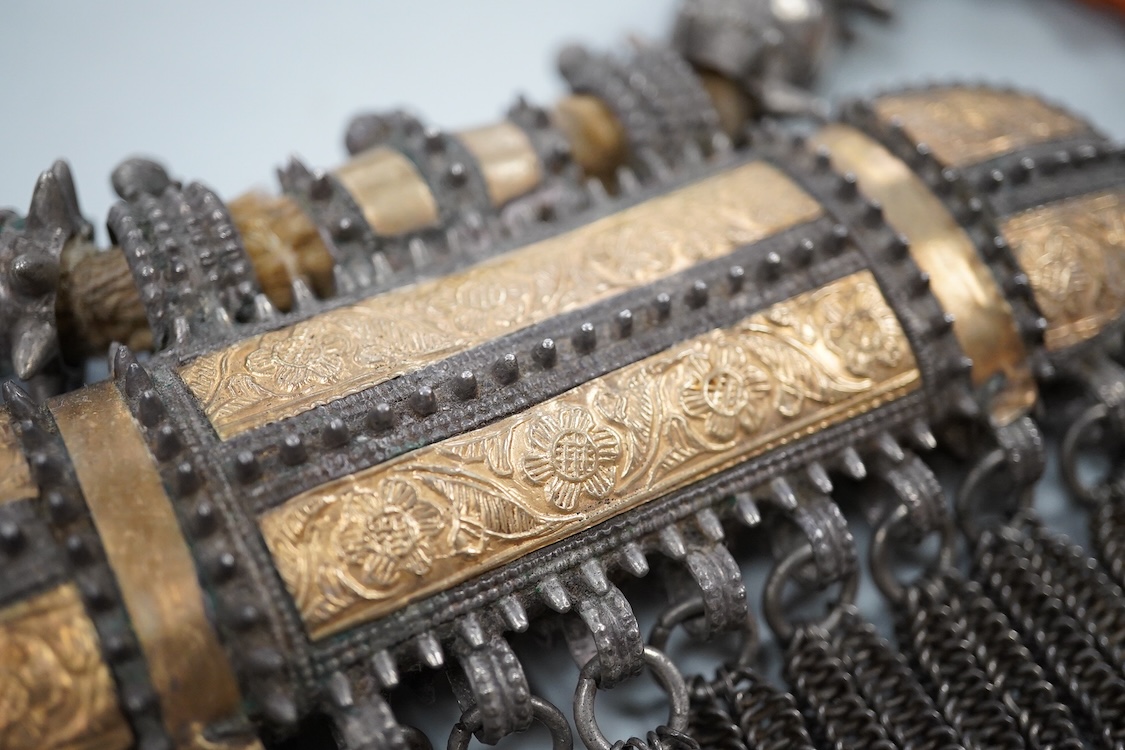 A Bedouin white metal and coral mounted necklace, from Oman, 58cm long